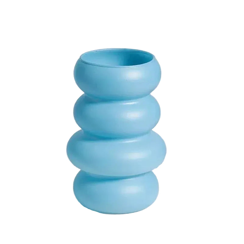 Blue cylindrical vase with measurements on a light grey background