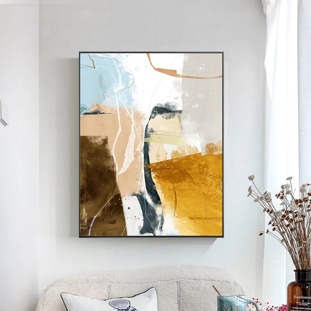 Abstract art print in a black frame on a wall above a sofa.