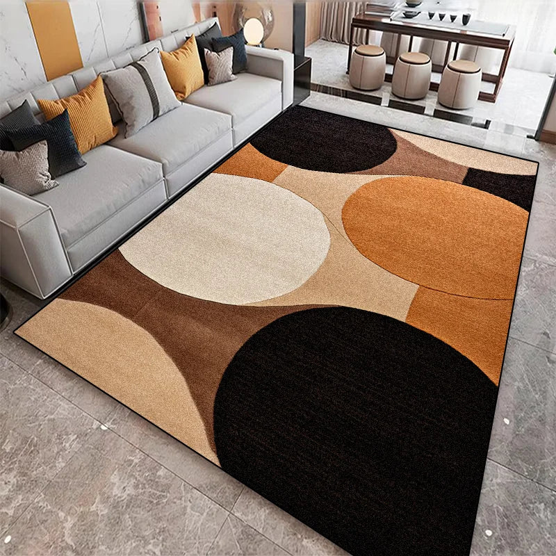 Earth tone rug with large overlapping circles in black, cream, and burnt orange displayed in a contemporary living space