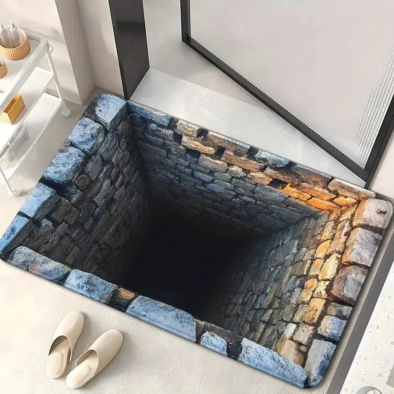 3D optical illusion floor mat featuring a square stone well with a blue-grey stone border