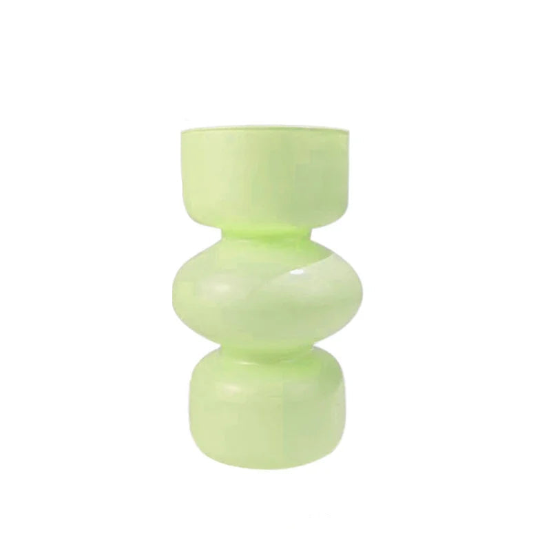 Green vase with measurements on a white background