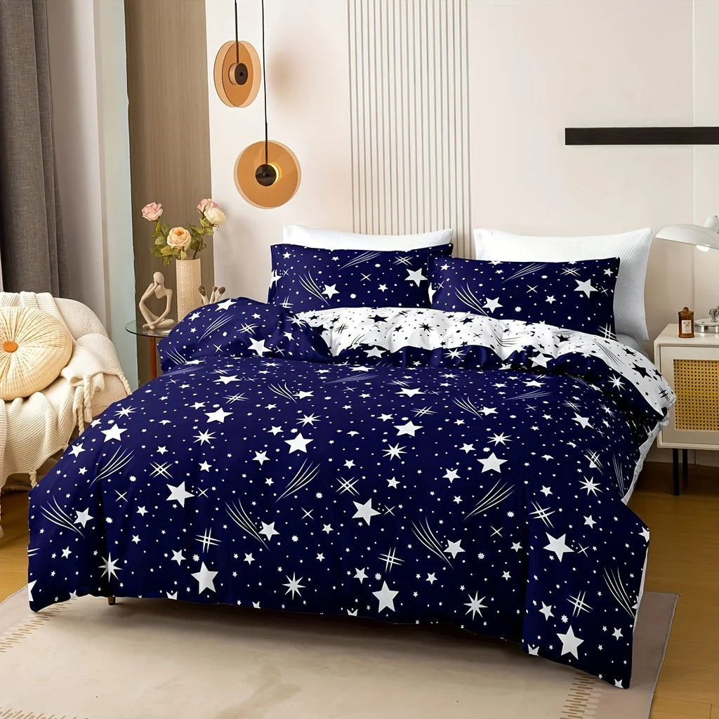 Navy blue bedding set with star pattern on a bed in a bedroom.