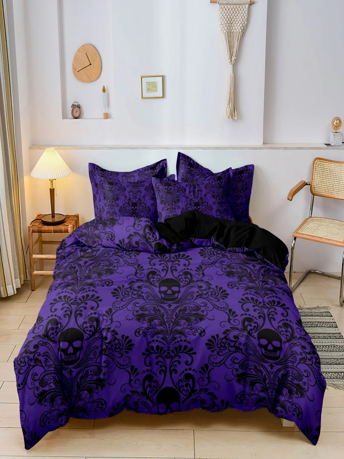Violet purple skull print duvet cover set styled on a bed with matching pillowcases