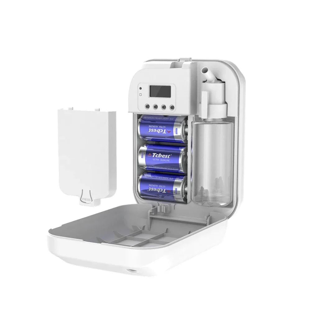White aroma diffuser open showing interior battery compartment with three AA batteries and a 150ml oil bottle