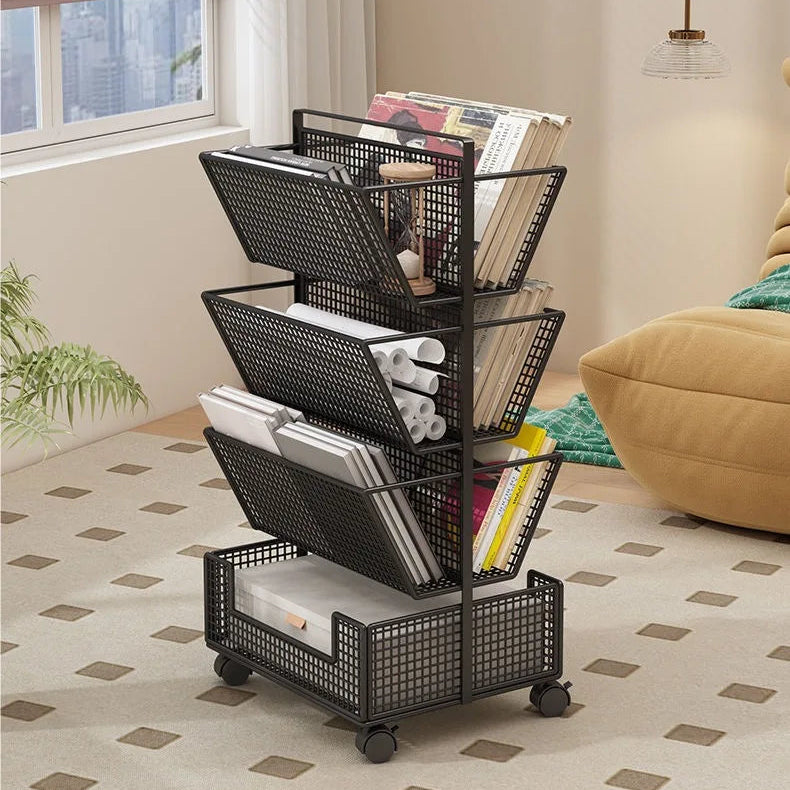 A black metal rolling magazine rack with four tiers and caster wheels, shown in a living room setting with books, magazines, and papers stored inside.