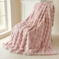 Pink fluffy blanket on a light-colored floor with a window in the background