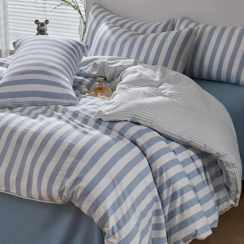 Powder blue and white striped twill bedding set with matching striped pillowcases