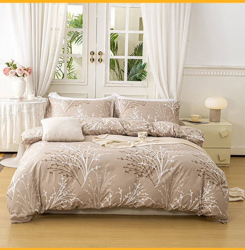 Sand beige duvet cover set with a delicate branch pattern and two matching pillowcases