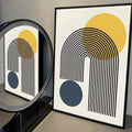 Contemporary abstract print with mustard circle, navy shape and black arch lines