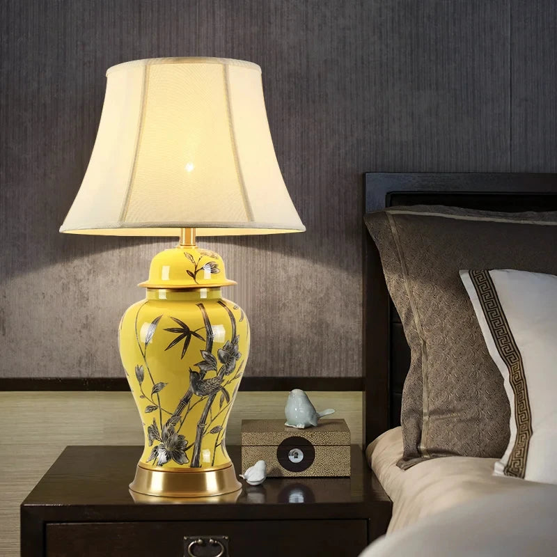 Tall yellow ceramic floral table lamp with a white fabric shade and a height of 68 cm