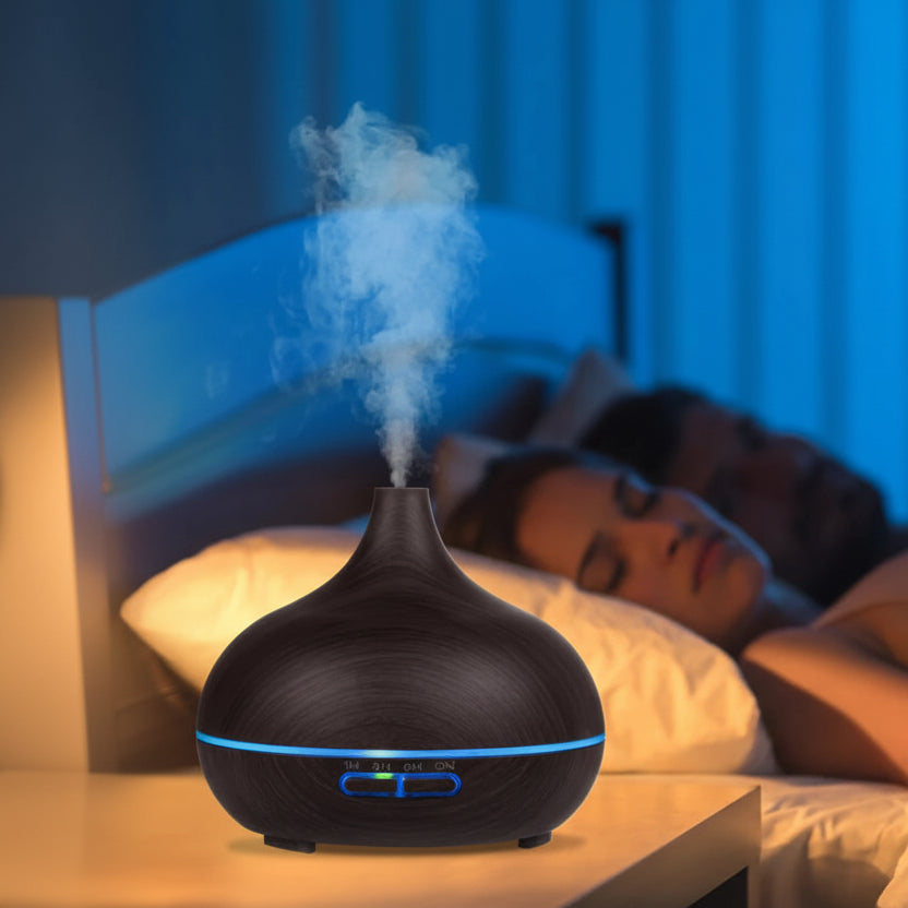 Quiet wood-grain diffuser releasing mist on a bedside table in a calming bedroom