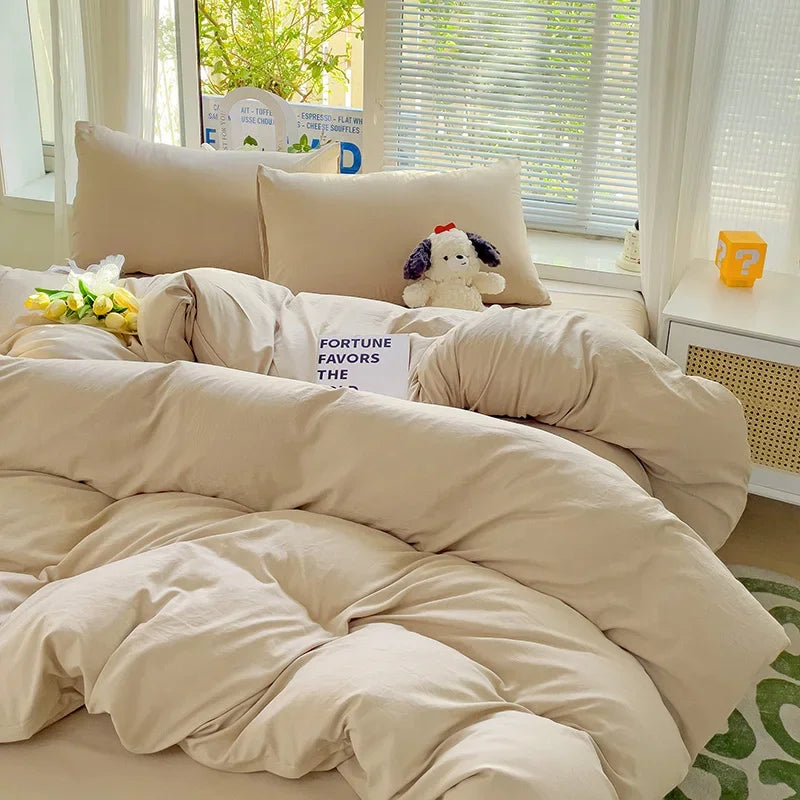 Soft beige cotton bedding set with relaxed, minimalist styling