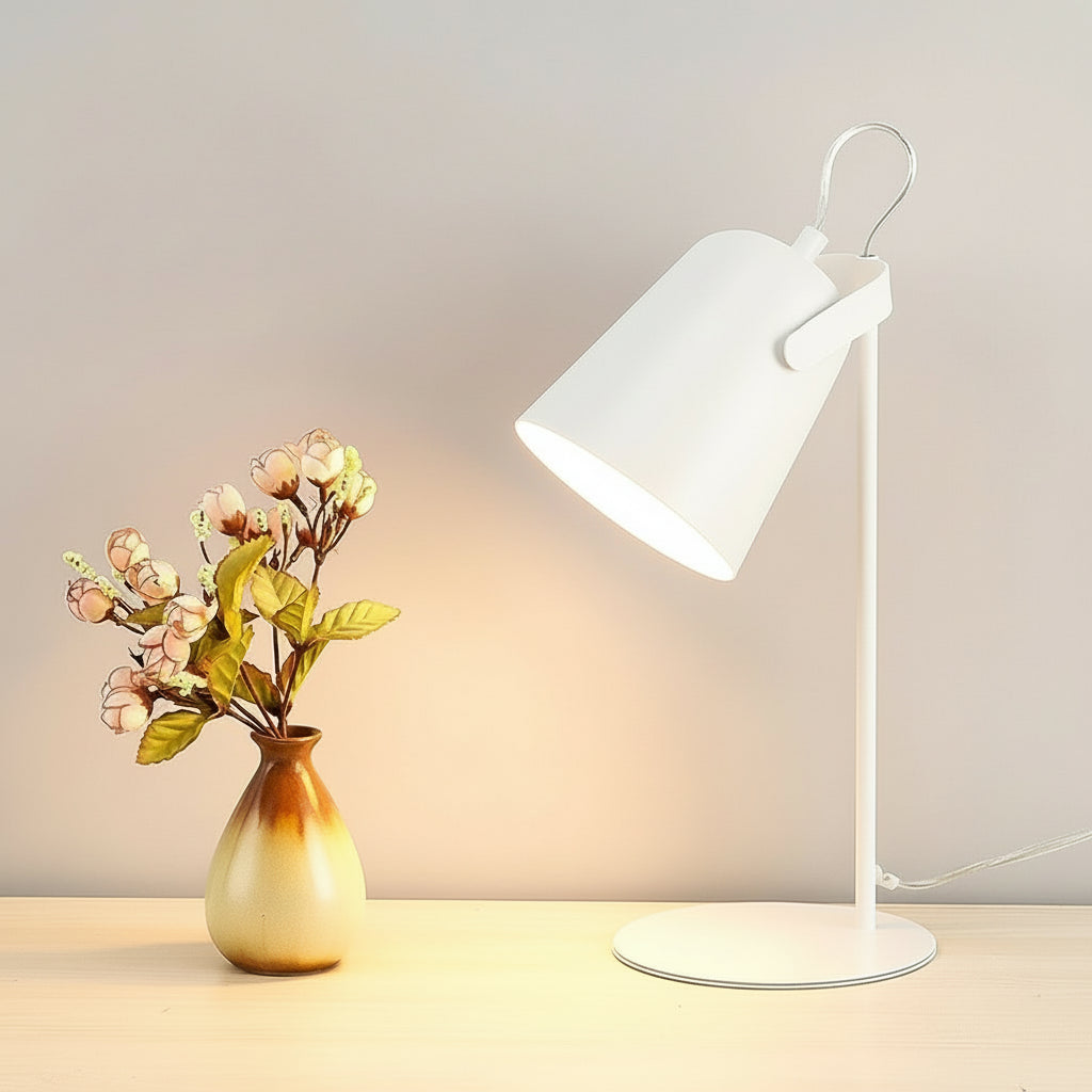 Table lamp with dimensions labeled next to a vase with flowers on a light background
