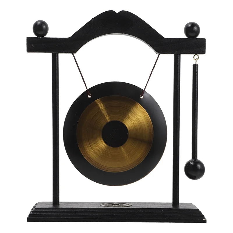 Decorative gong on a stand with black frame and gold center