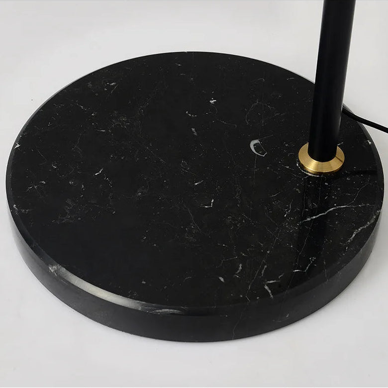 Black marble base of a lamp on a white background