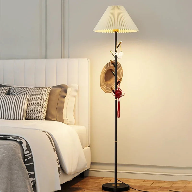 Black LED floor lamp with pleated fabric shade and marble base