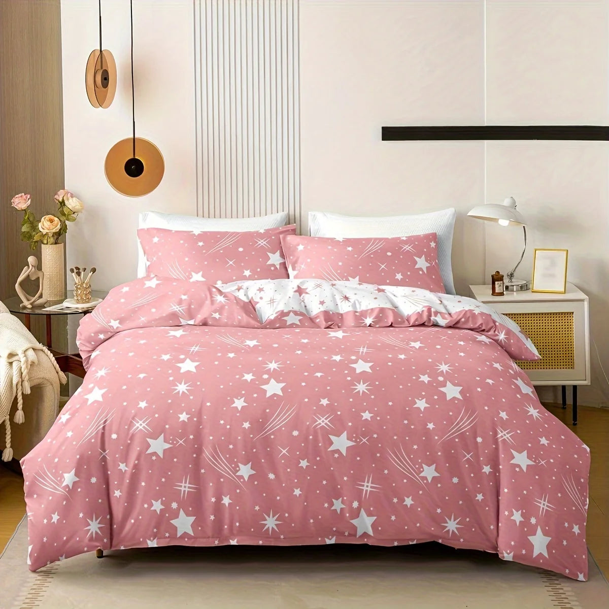 Pink star-patterned bedding set on a bed in a bedroom setting.