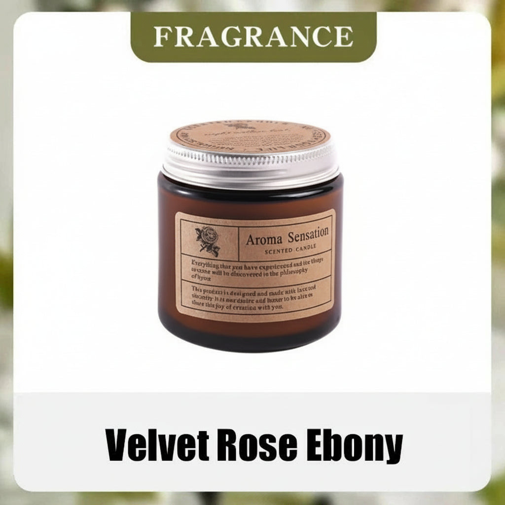 Aroma Sensation scented candle labeled 'Velvet Rose Ebony' with fragrance notes on a blurred background.