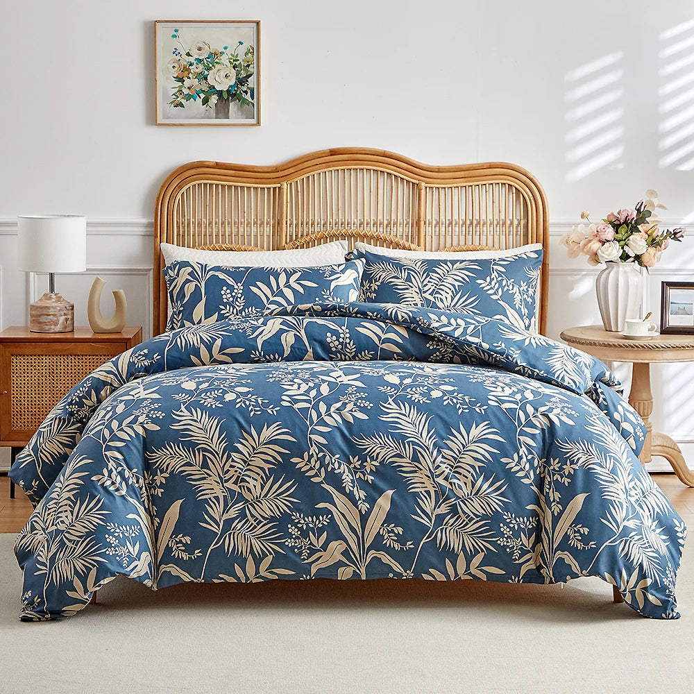 Deep blue duvet cover set with beige botanical foliage print and matching pillowcases