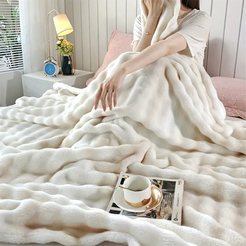 A person wrapped in a white blanket in a cosy room with a lamp and a clock.