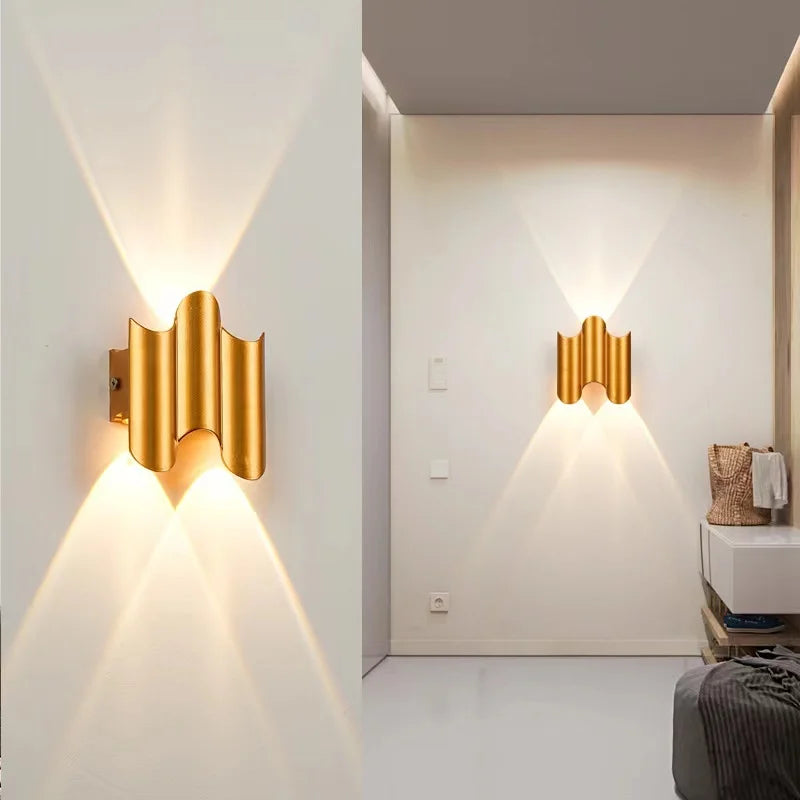 Gold 2-wave wall light with compact ripple profile and elegant up-and-down lighting pattern