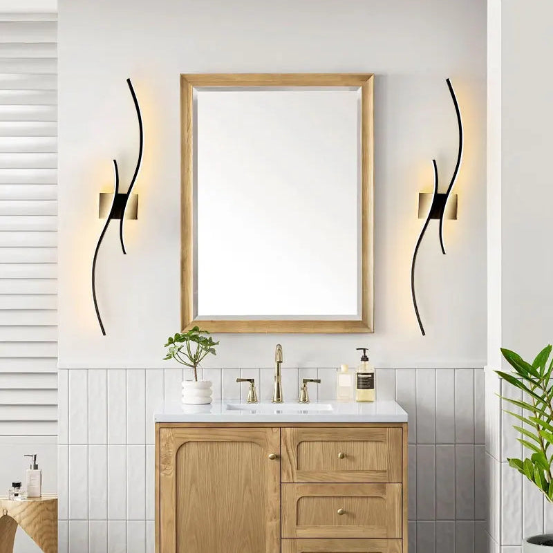 Modern black wall sconce in a dining room setting with chairs and a window.