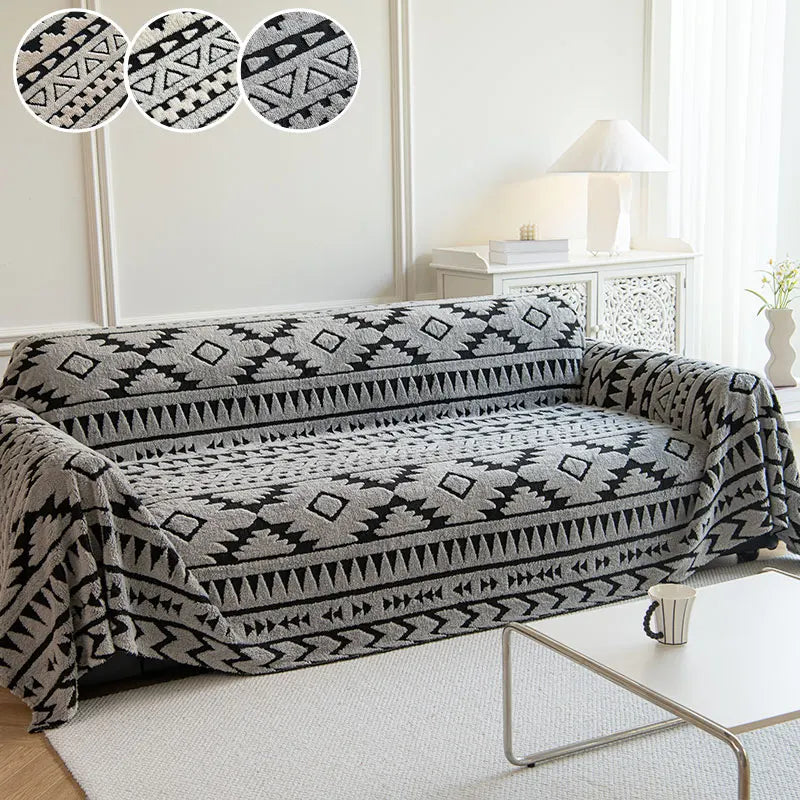 Charcoal geometric armchair throw styled in a minimalist living room setup.