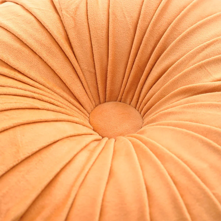 Close-up of a pleated orange cushion