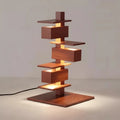 Rosewood grain geometric table lamp with stacked metal design, 46cm height and 25cm base