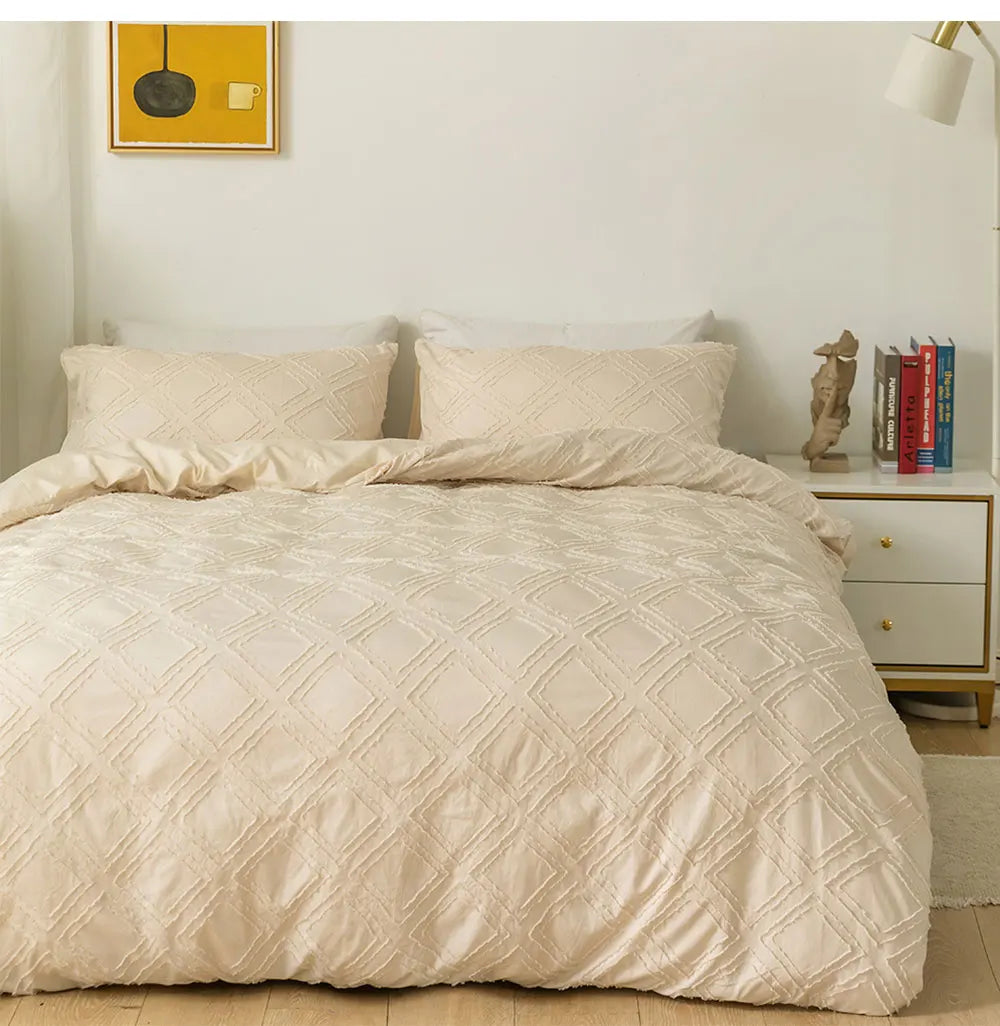Cream textured geometric bedding set with matching pillowcases styled on a minimalist bed