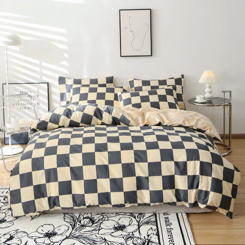 Checkered bedspread on a bed in a bedroom with decor elements.