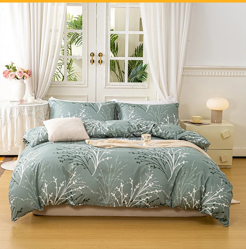 Sage green bedding set with soft botanical print styled in a bright minimalist bedroom