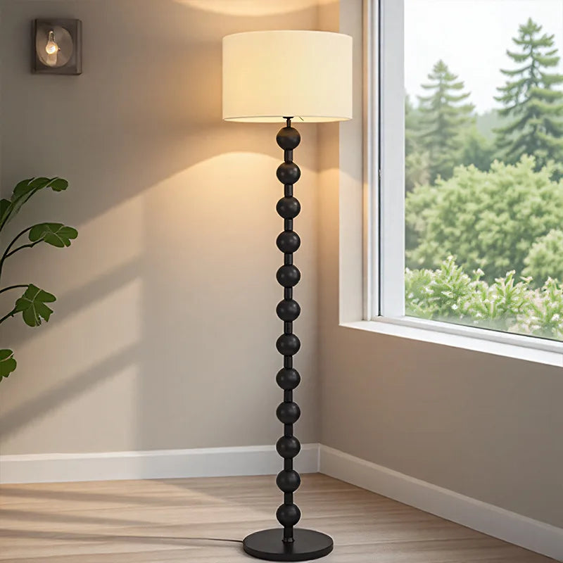 Midnight black edition of the sphere floor lamp with a 155cm height and a 35cm wide fabric shade.