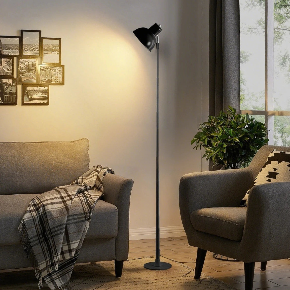 Modern living room with grey sofa, armchair, and black floor lamp.