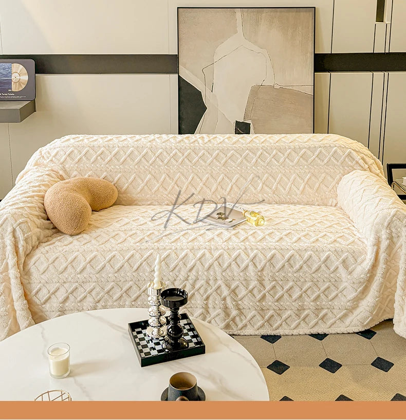 Beige textured sofa with decorative pillows in a living room setting.