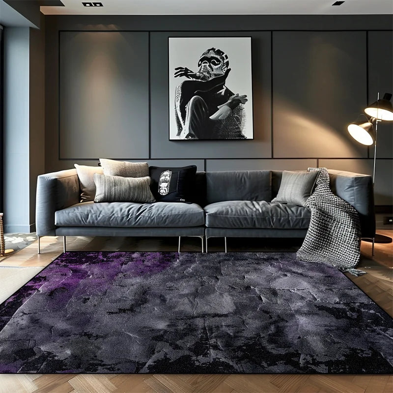 Dark charcoal and plum abstract area rug with textured wash effect in a contemporary dark living room with grey sofa