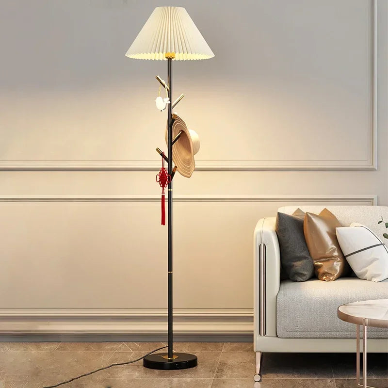 Black LED floor lamp with pleated fabric shade and marble base