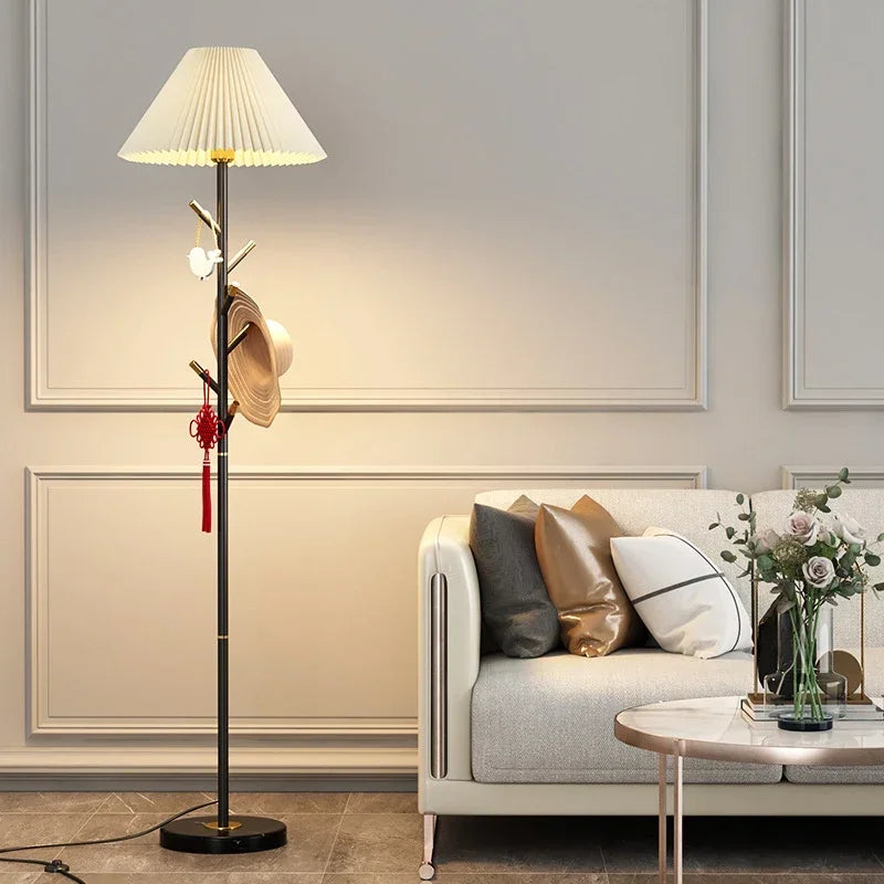 Black LED floor lamp with pleated fabric shade and marble base