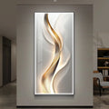 Bold gold ribbon abstract LED wall art panel with warm backlighting in a contemporary living space