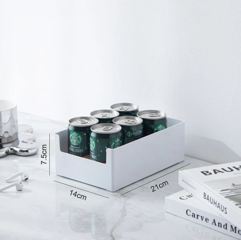 Starbucks coffee cans in a white organizer with dimensions displayed