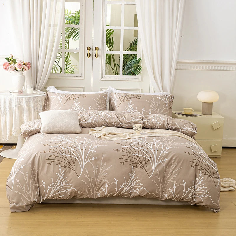 Sand beige duvet cover set with a delicate branch pattern and two matching pillowcases