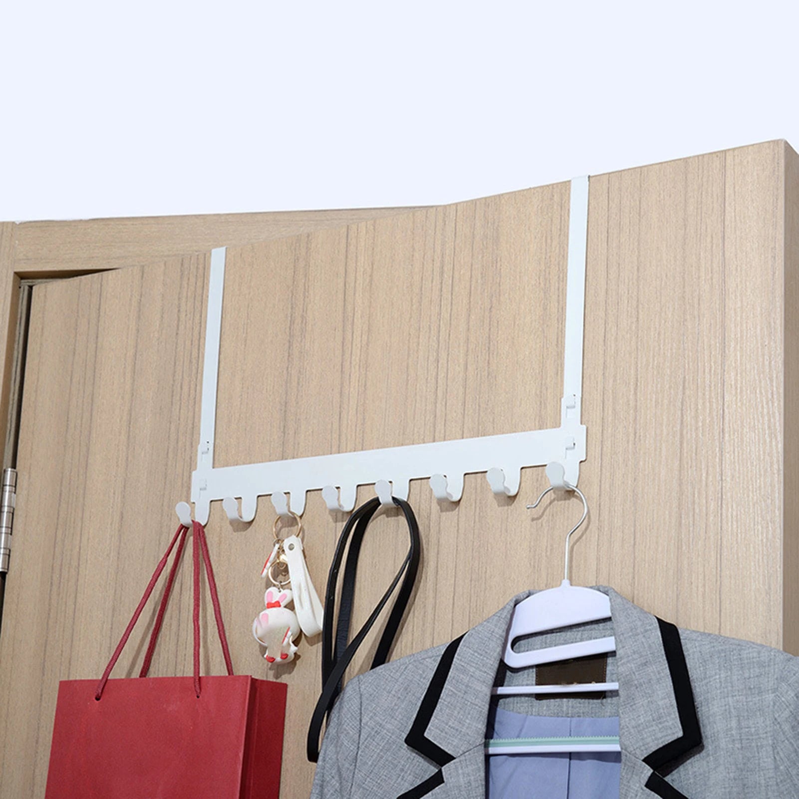 White over-the-door organiser rack.