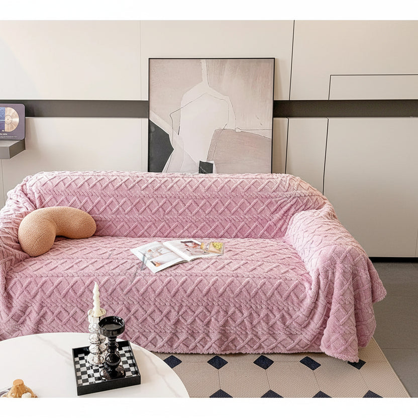 Pink textured sofa cover on a couch with a neutral background