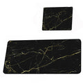 Two black marble placemats with gold veins on a white background
