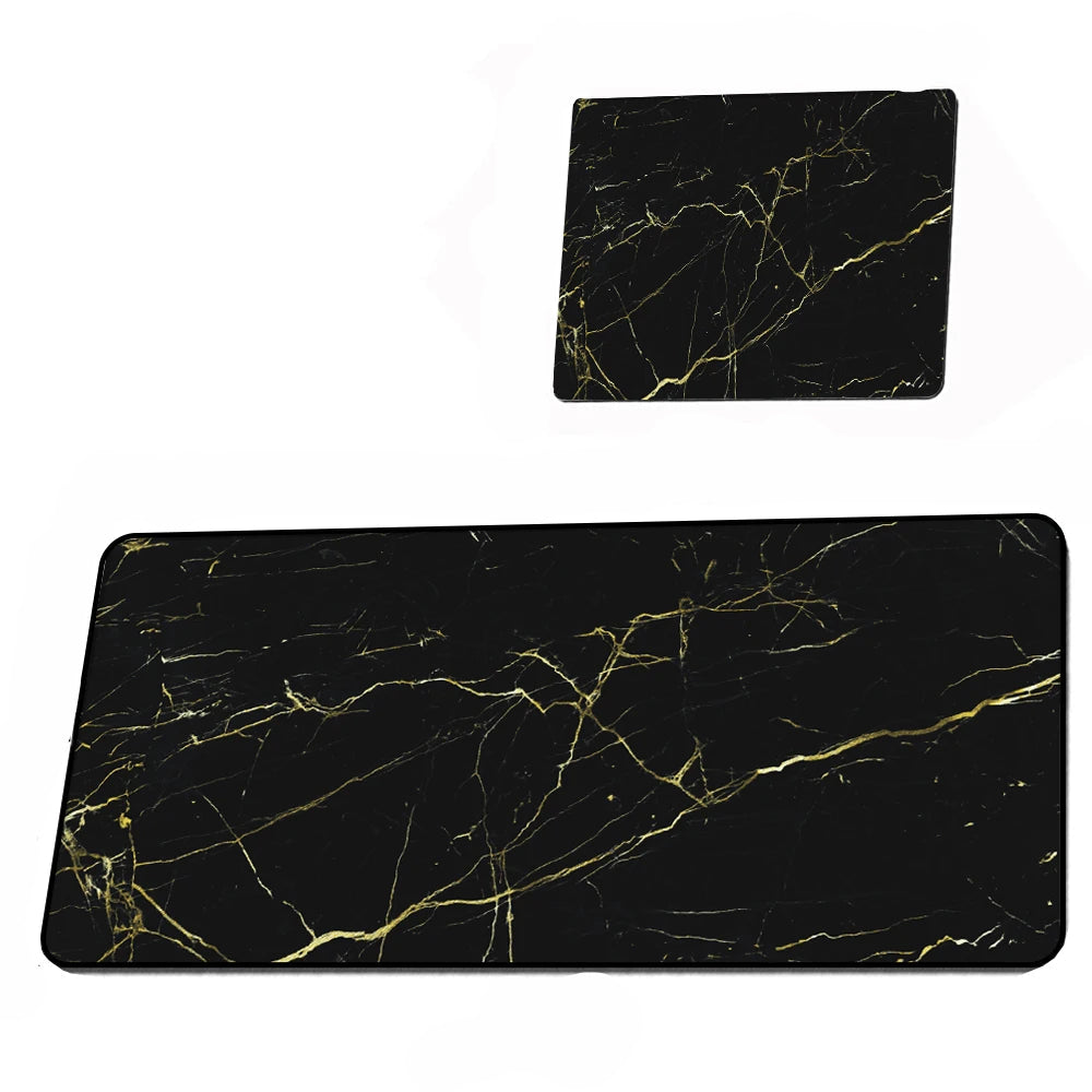 Two black marble placemats with gold veins on a white background