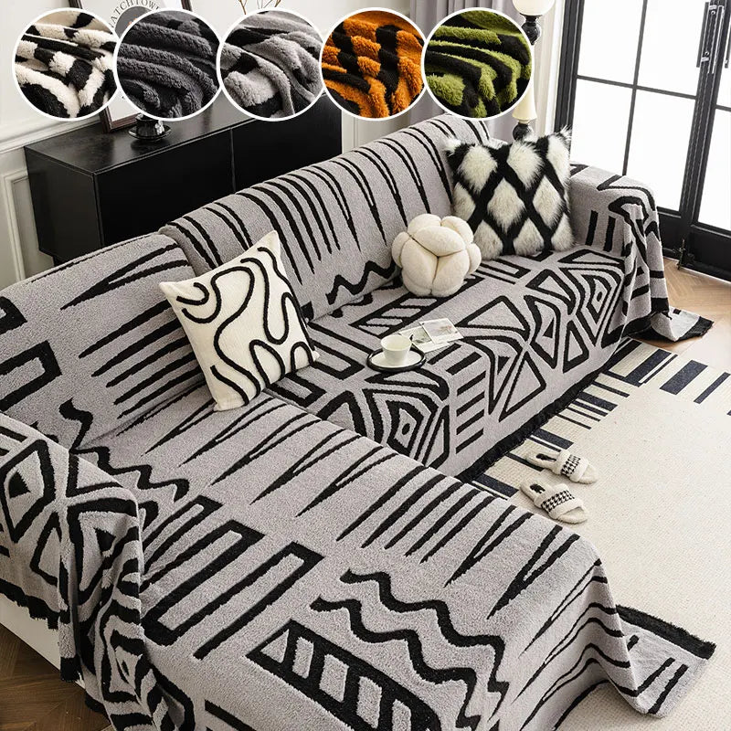 Light grey tribal print sofa cover on L-shaped couch with cushions