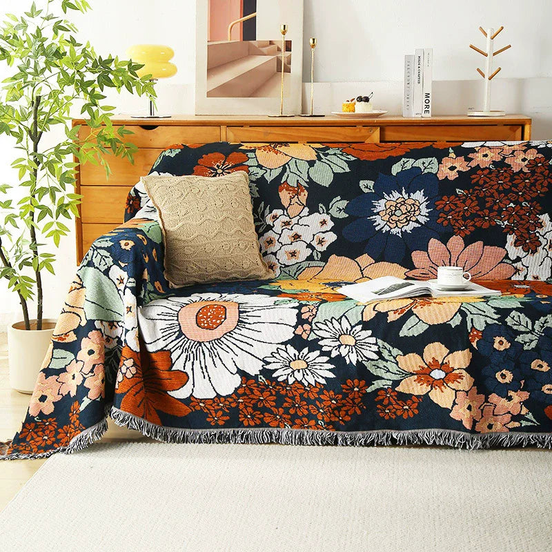 Midnight Floral throw blanket covering a wooden console-style sofa setup