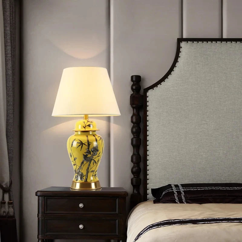 Tall yellow ceramic floral table lamp with a white fabric shade and a height of 68 cm