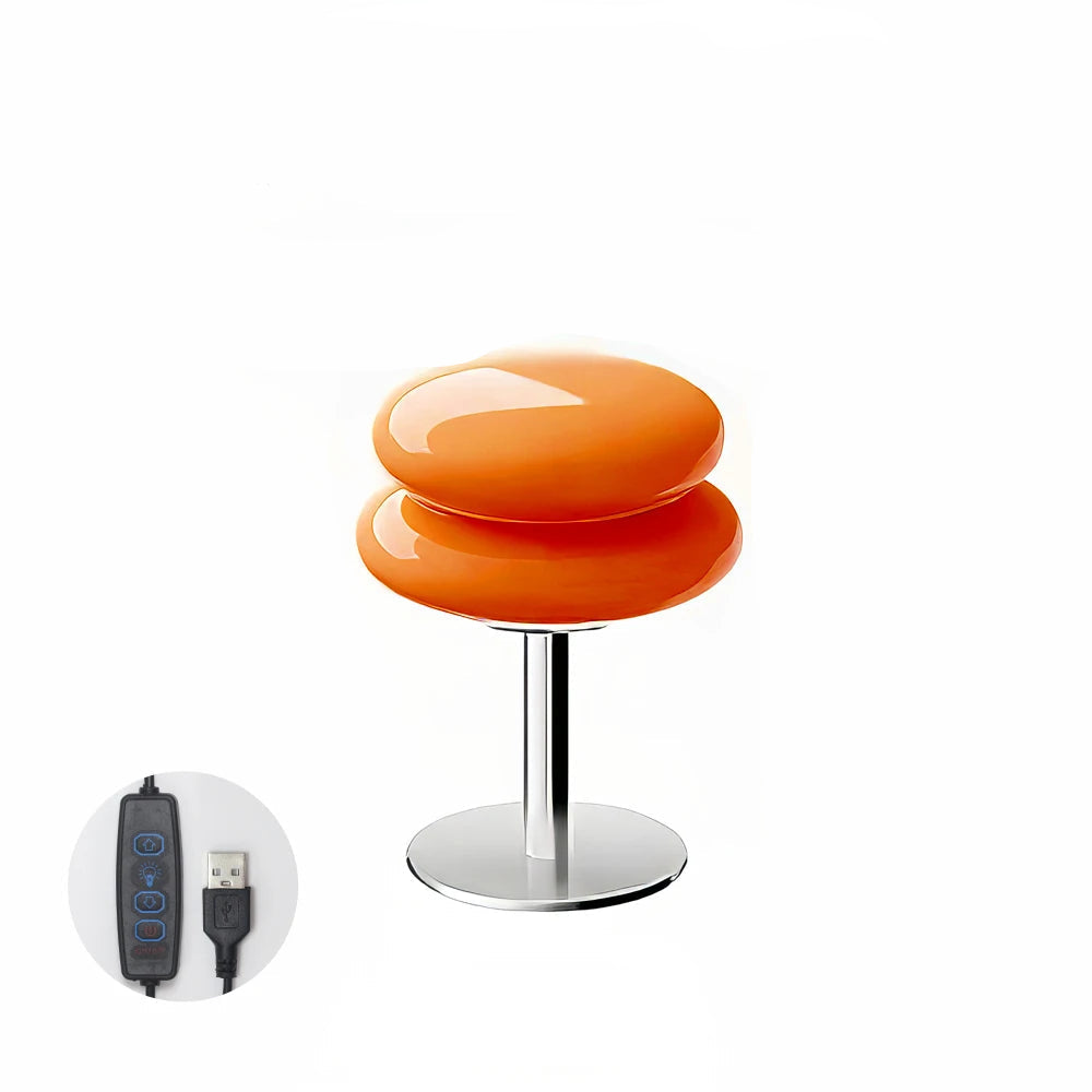 An Orange modern table lamp with a USB cable icon on a white background