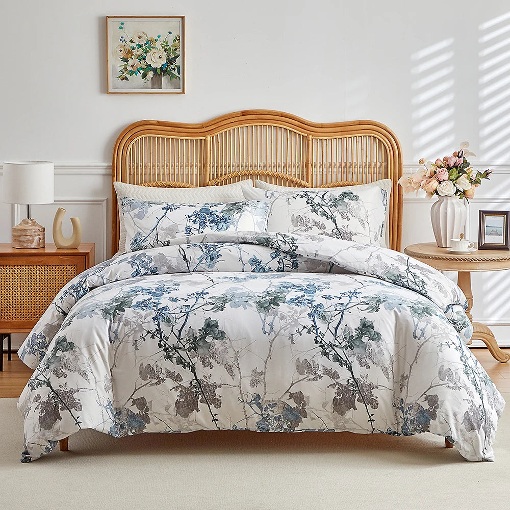White duvet cover set with blue and taupe branch floral print and matching pillowcases